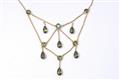 A 14k gold and peridot belle epoque garland form collier - image-1