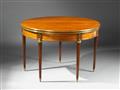 A Neoclassical brass-mounted mahogany convertible table. - image-1