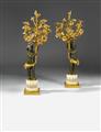 A pair of Parisian fire-gilt and burnished bronze candelabra. - image-1
