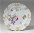 A relief bordered Meissen porcelain platter with floral decor. - image-1