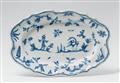 An oval Alcora faience dish with blue "grotteschi" decor - image-3