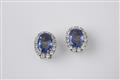 A pair of 18k gold and Ceylon sapphire clip earrings - image-1