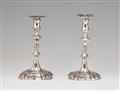 A pair of George II silver tapersticks - image-1