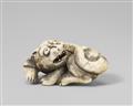 A Kyoto school ivory netsuke of a recumbent tiger. Late 18th century - image-1