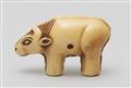 An Osaka school ivory netsuke of a toy figurine of an ox. Mid-19th century - image-2