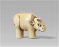 An Osaka school ivory netsuke of a toy figurine of an ox. Mid-19th century - image-1