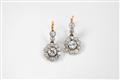 A pair of 14k gold and diamond pendant earrings - image-1