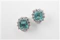 A pair of 18k white gold, emerald, and diamond clip earrings - image-2