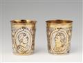 A pair of parcel-gilt Leipzig silver beakers - image-1