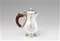 A Queen Anne silver hot milk jug - image-1