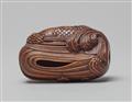 A large boxwood netsuke of a carp leaping up a waterfall. Early 20th century - image-2