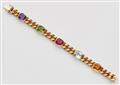 An 18k gold and coloured gemstone bracelet - image-1