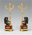 A rare pair of ormolu candelabra with kneeling figures of Victory - image-1