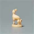 A walrus tooth netsuke of a dog on an oval base. Second half 19th century - image-3