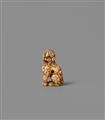 An ivory netsuke of a seated shishi. Around 1800 - image-4