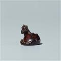 A tagayasan wood netsuke of a reclining horse. Probably last third 19th century - image-3