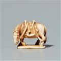 An ivory netsuke of a horse on an oval base. Late 19th century - image-1