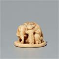 A narwhal netsuke of an elephant with Chinese men. 18th century - image-1