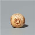 An ivory netsuke of a sphere with stylised blossoms. Late 19th century - image-3