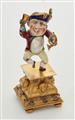 A miniature gold statuette of a drinking dwarf - image-1