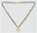 An 18k gold necklace with a diamond solitaire pendant - image-1