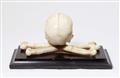 A carved marble skull and crossbones - image-2