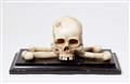 A carved marble skull and crossbones - image-1