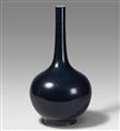 A large blueish-black-glazed bottle vase. 20th century - image-1