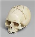 An ivory netsuke of a realistic model of a skull. Late 19th century - image-1