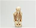 A marine ivory netsuke of a crouching skeletton. Early 20th century - image-2