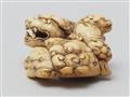 An ivory netsuke of a shishi with cub. 18th century - image-2