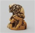 An ivory netsuke of a shishi by a rock. Late 18th century - image-4