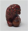 A boxwood and negoro-lacquered netsuke of a shishi. Early 19th century - image-4