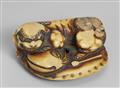 A stained ivory netsuke of a shishi lying on a cushion. Early 19th century - image-1