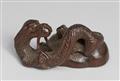 A wood netsuke of a slender  two-horned dragon. 19th century - image-1