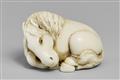 An ivory netsuke of a recumbent horse. Late 19th century - image-1