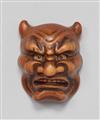 A wood netsuke of an Oni mask. 19th century - image-1