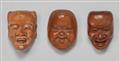 Three boxwood mask netsuke from a set. Around 1900 - image-1