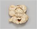 An ivory netsuke of a group of masks. Mid-19th century - image-1