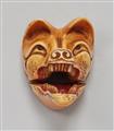 A stained ivory netsuke of a Kitsune mask. 19th century - image-1