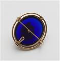 A 14k gold pendant brooch with a blue paste cabochon - image-2