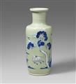 A blue and white, underglaze copper-red and white-slip-decorated celadon-ground rouleau vase. Kangxi period (1662-1722) - image-1