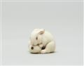 An ivory netsuke of a hare with a biwa-fruit. Second half 19th century - image-2