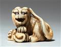 An ivory netsuke of a tiger with young. Mid-19th century - image-1