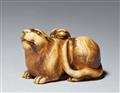 An ivory netsuke of a tiger with young. 19th century - image-1