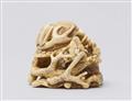 An ivory netsuke of a kabuto on plum branches. Second half 19th century - image-2