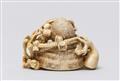 An ivory netsuke of a kabuto on plum branches. Second half 19th century - image-3