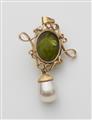 A silver and gold peridot pendant - image-2