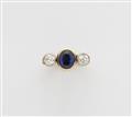 An 18k gold sapphire trinity ring - image-1