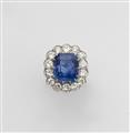 A platinum diamond and natural Ceylon sapphire cluster ring - image-1